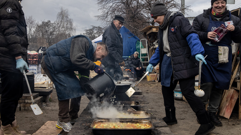 people lining up for food