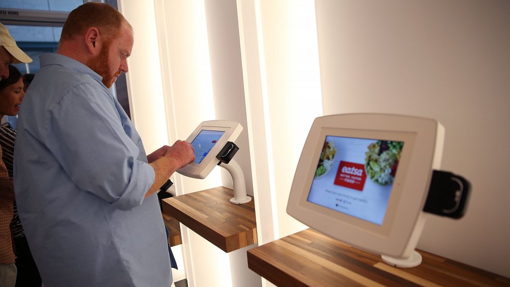 customer at a self-service kiosk