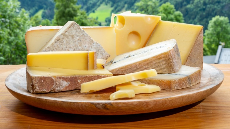 assortment of hard cheeses on a platter