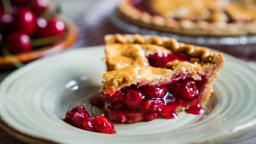 Cherry pie slice on white plate