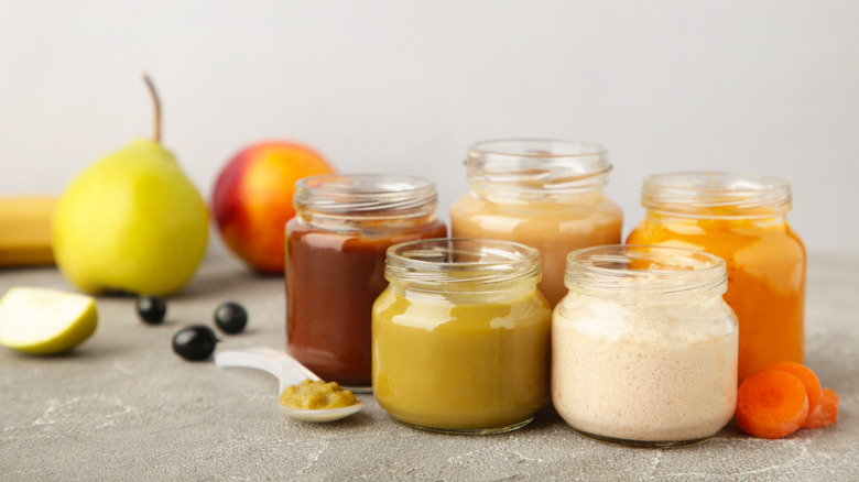 Different types of baby food with spoon