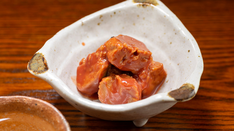 Cubes of fermented tofu in a small bowl.