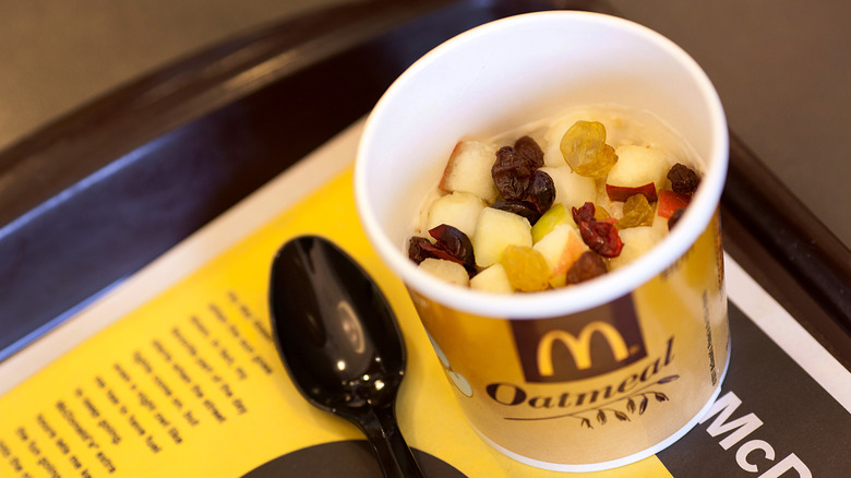 McDonald's fruit and maple oatmeal in cup with spoon