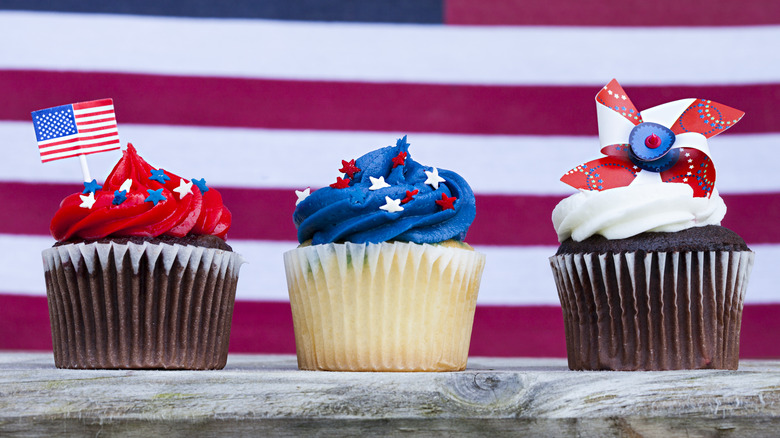 Patriotic American cupcakes against flag