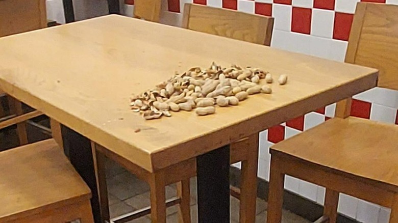 Peanut shells on a table at Five Guys