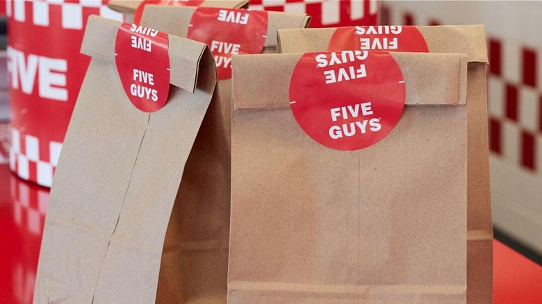 Sealed takeout bags from Five Guys