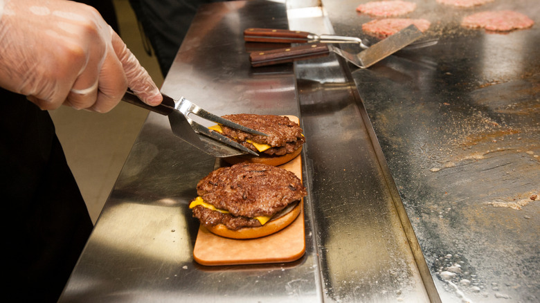 Steakburgers being cooked on grill