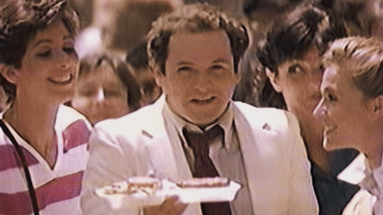 Jason Alexander holding a McDLT in a crowd 