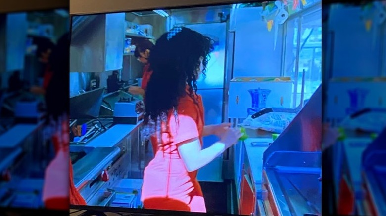 A cooking show contestant wearing her hair down