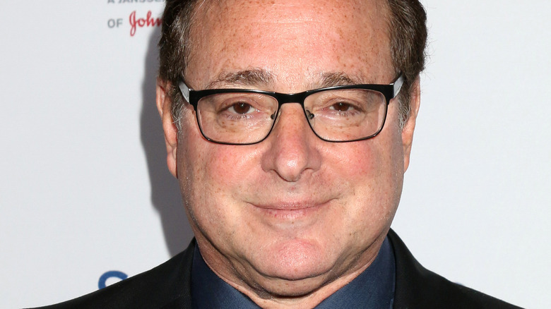 Bob Saget smirking