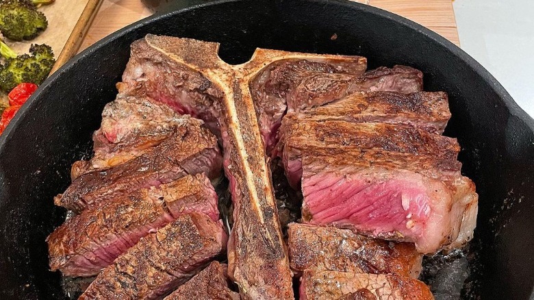 seasoned porterhouse steak in pan