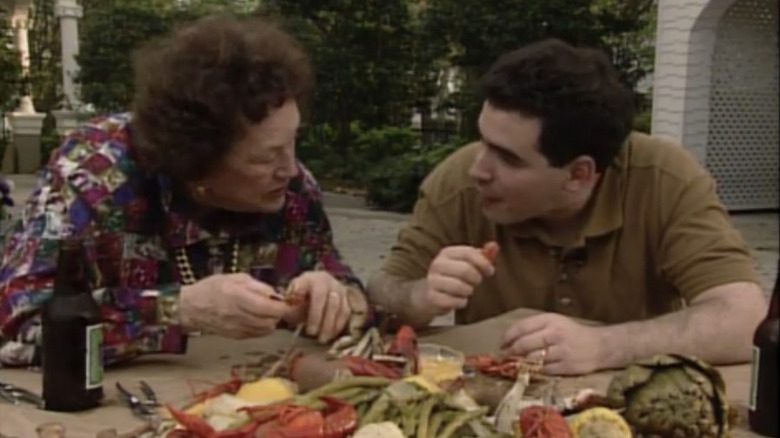 Julia Child and Emeril Lagasse eat a crawfish boil together