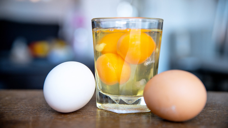 Raw eggs in a glass