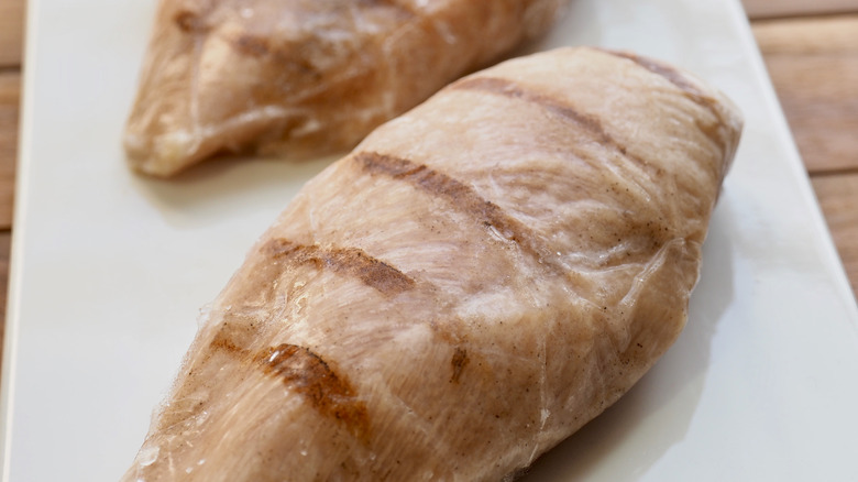 frozen roasted chicken wrapped in plastic