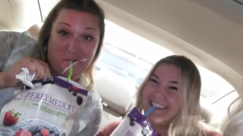 Women with adult beverage pouches