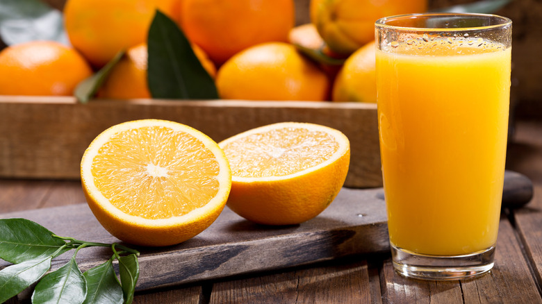 Orange juice on brown wood