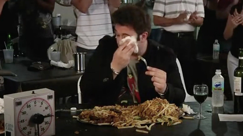 Adam Richman wipes sweat