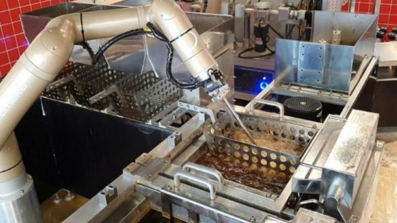 robotic arm frying chicken in korea