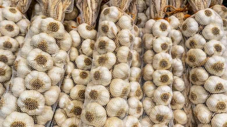 Multiple mesh bags filled with garlic