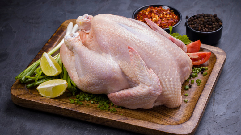 raw chicken on cutting board