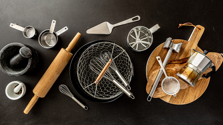 Kitchen utensils on a black background