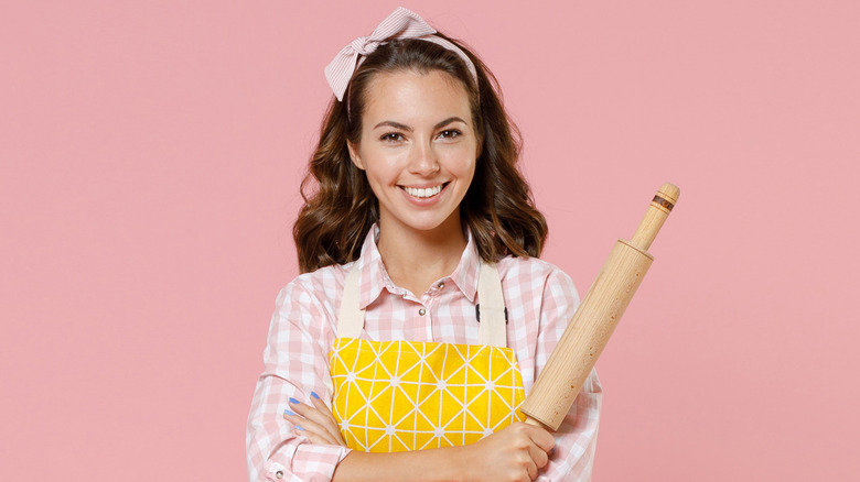 A woman with a rolling pin