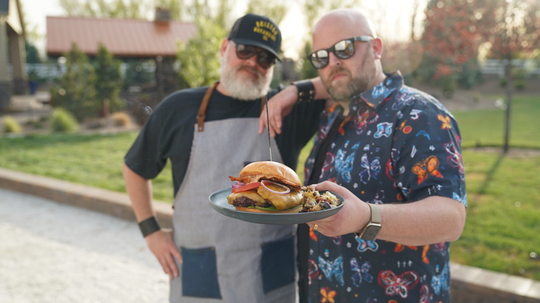 The Grill Dads with a plated burger