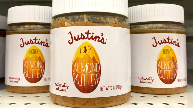 Jars of Justin's brand Honey Almond Butter on store shelf