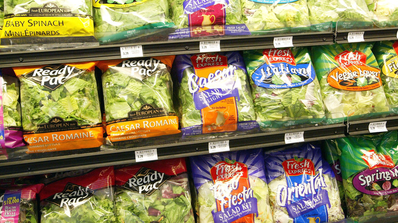 Rows of prepackaged salads in gorcery store