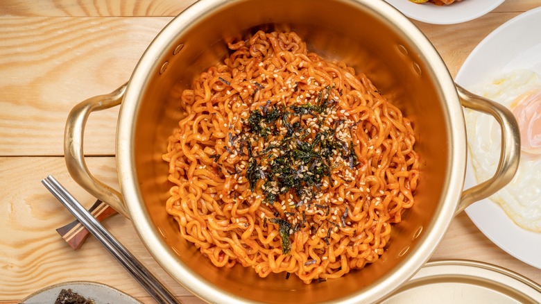 ramen with chili sauce in a pot