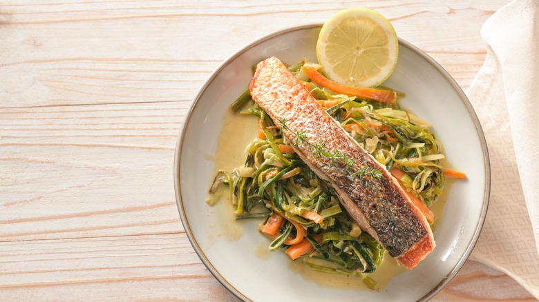 plate of cooked salmon with crispy skin