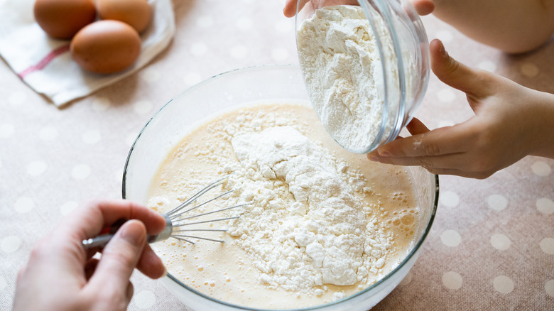 Mixing batter with flour