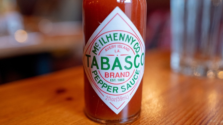 Tabasco hot sauce bottle on wood table