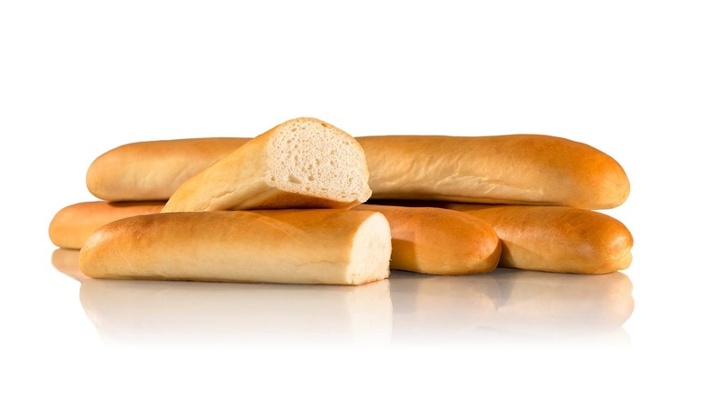 assortment of Jimmy John's French bread on white background