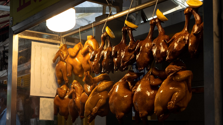 Hanging roast chickens