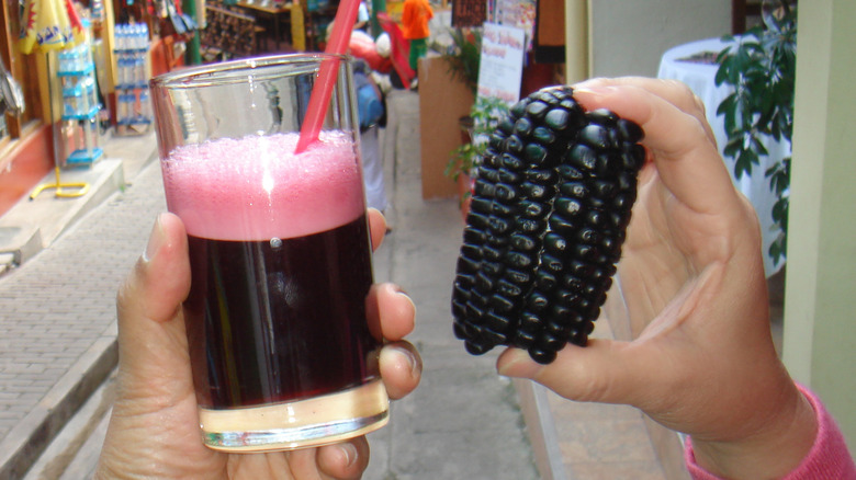 Glass of chicha morada with corn