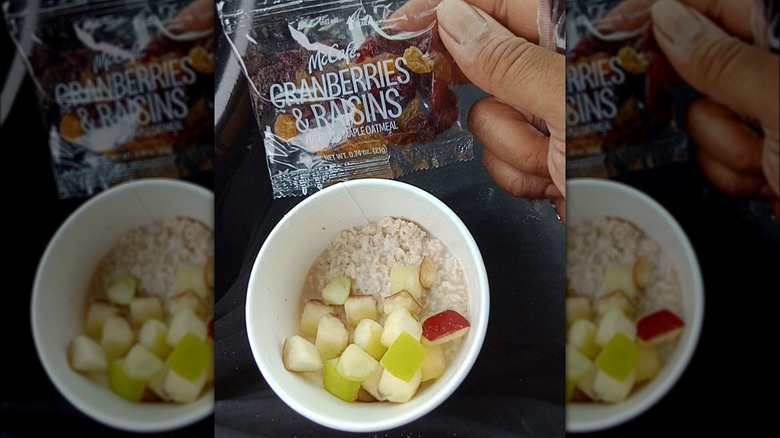 Bowl of oatmeal with bag of raisins