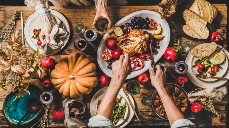 hands around thanksgiving table