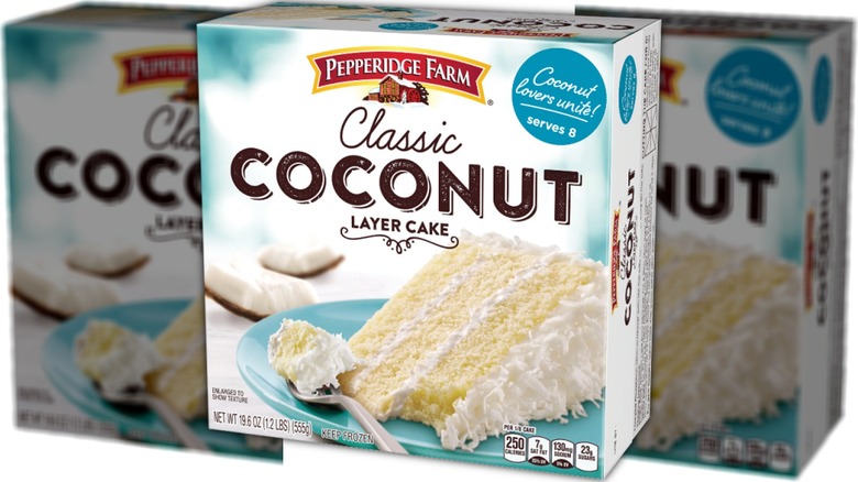 Box showing slice of coconut layer cake