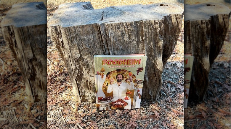 Foodheim book propped on tree stump