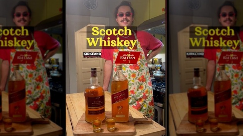 Person standing in front of whiskey bottles