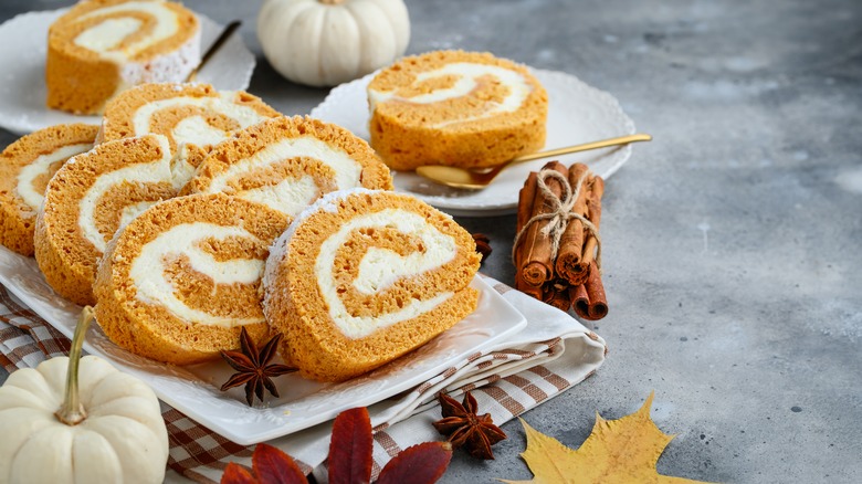 Pumpkin cake roll sliced and piled on a dish