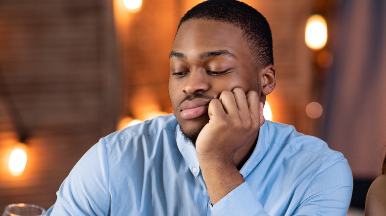 an unhappy Black male diner