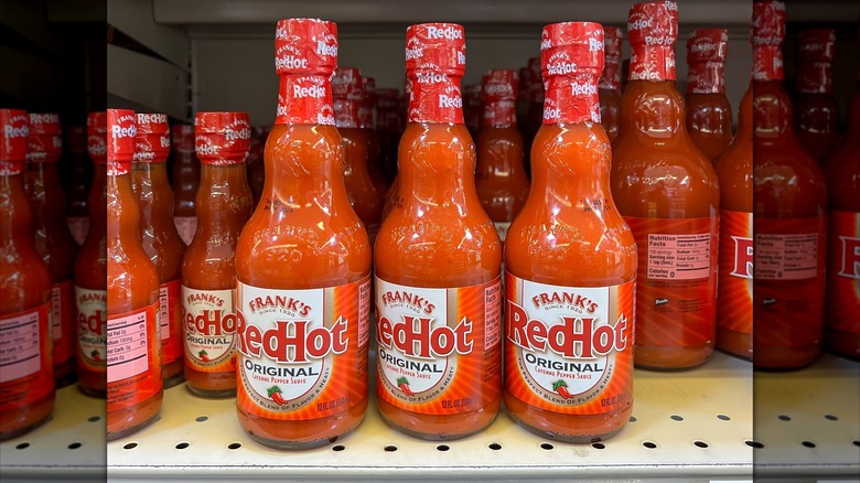 bottles of Frank's RedHot Sauce at grocery store