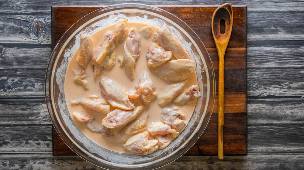 chicken wings marinating for hot wings recipe