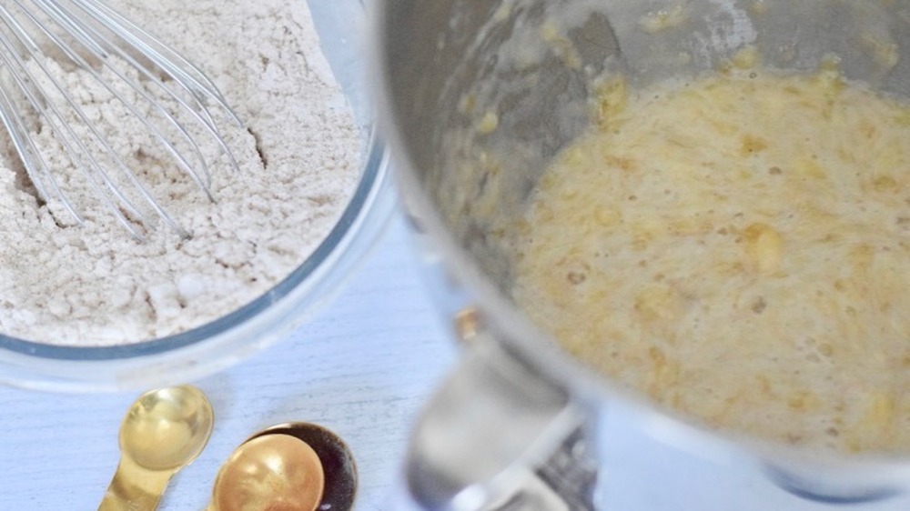 mashed bananas and dry ingredients for hummingbird cake recipe