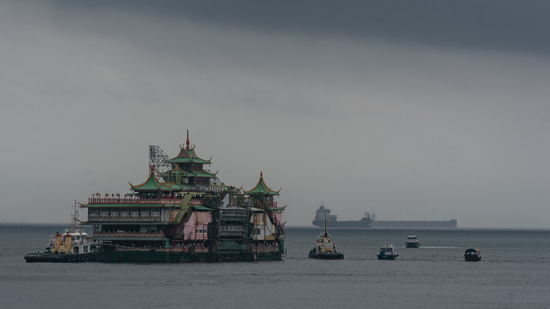 Jumbo floating restaurant on tow