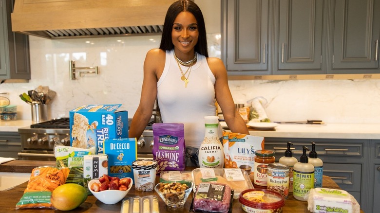 Ciara posing with food items