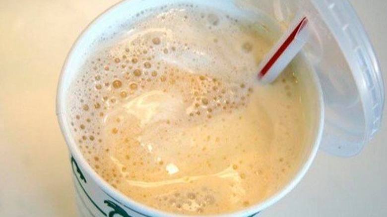 Root beer float with straw