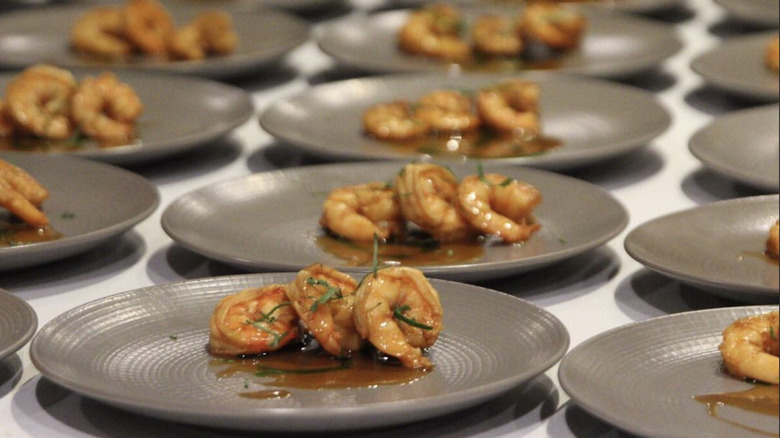 Rows of plates with shrimp